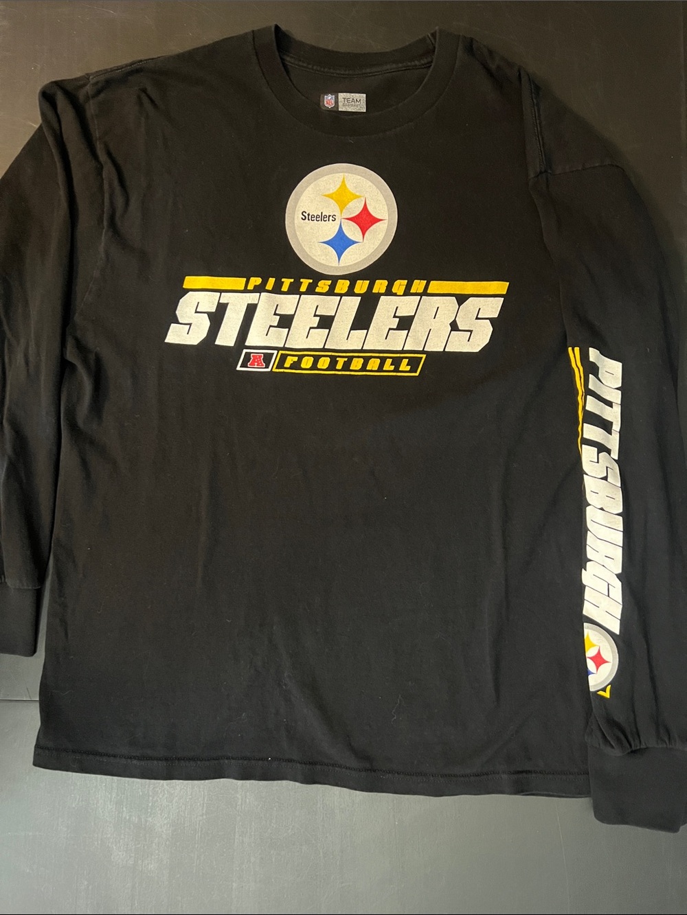 Team Apparel Black Steelers Logo Crewneck Tee with Yellow, Red & Blue Accents